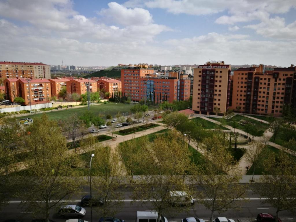 a view of a city with buildings and a park at Apartamentos Torr Zona Caja Mágica, Hospital 12 de Octubre - Con Garaje Incluido in Madrid