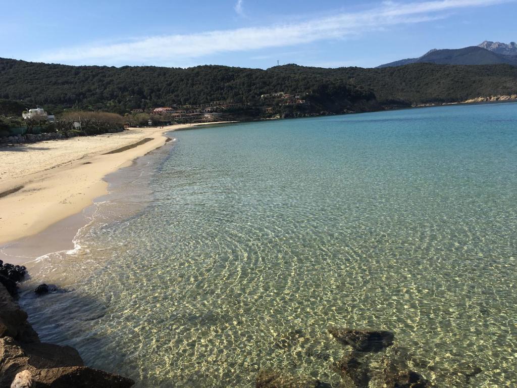 a view of a beach with the sand and water at Hotel Danila in Portoferraio
