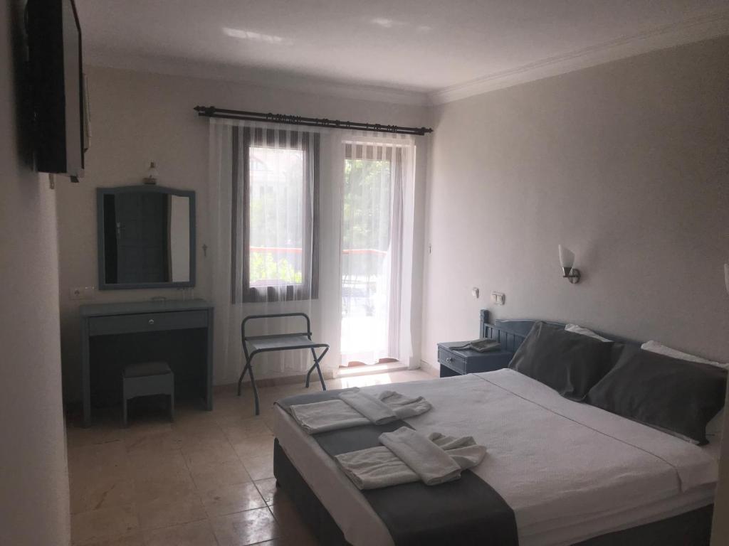 TV a/nebo společenská místnost v ubytování Kilim Hotel & Apart