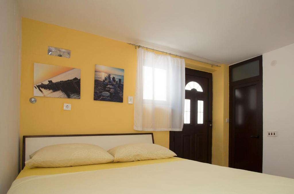 Postel nebo postele na pokoji v ubytování Room Dioklecijan