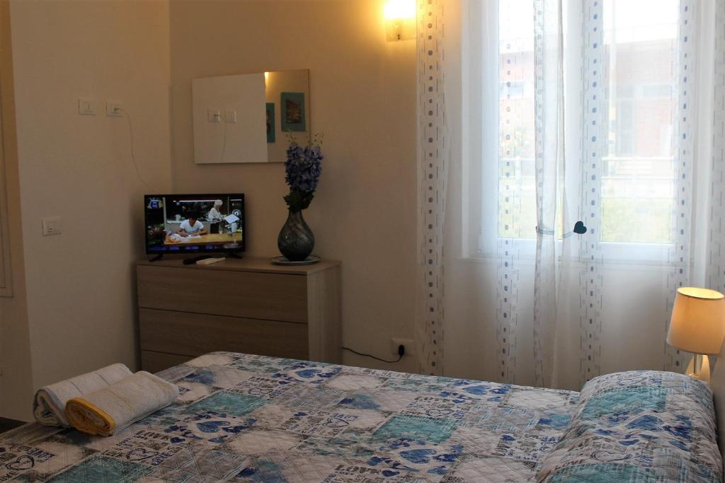 Postel nebo postele na pokoji v ubytování Loft La Conchiglia