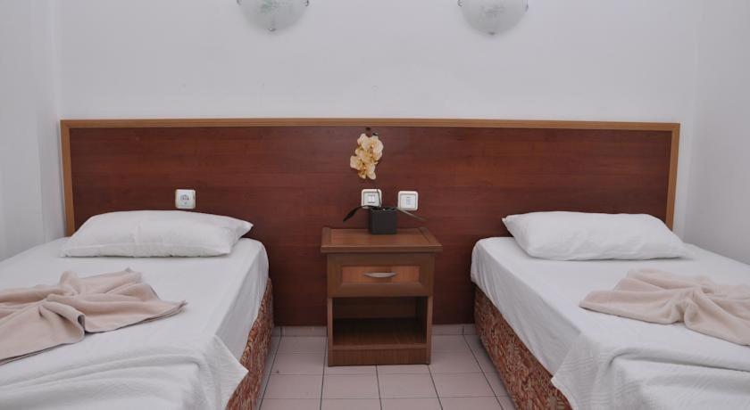 Postel nebo postele na pokoji v ubytování Latino Hotel