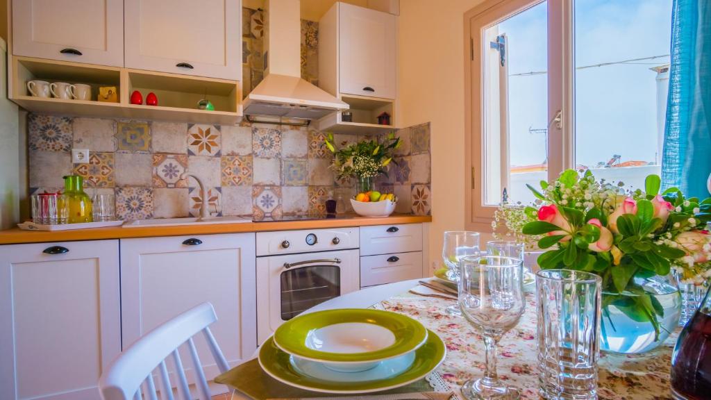 a kitchen with a table with a plate on it at Maribella Residence Old Town Rethymno in Rethymno
