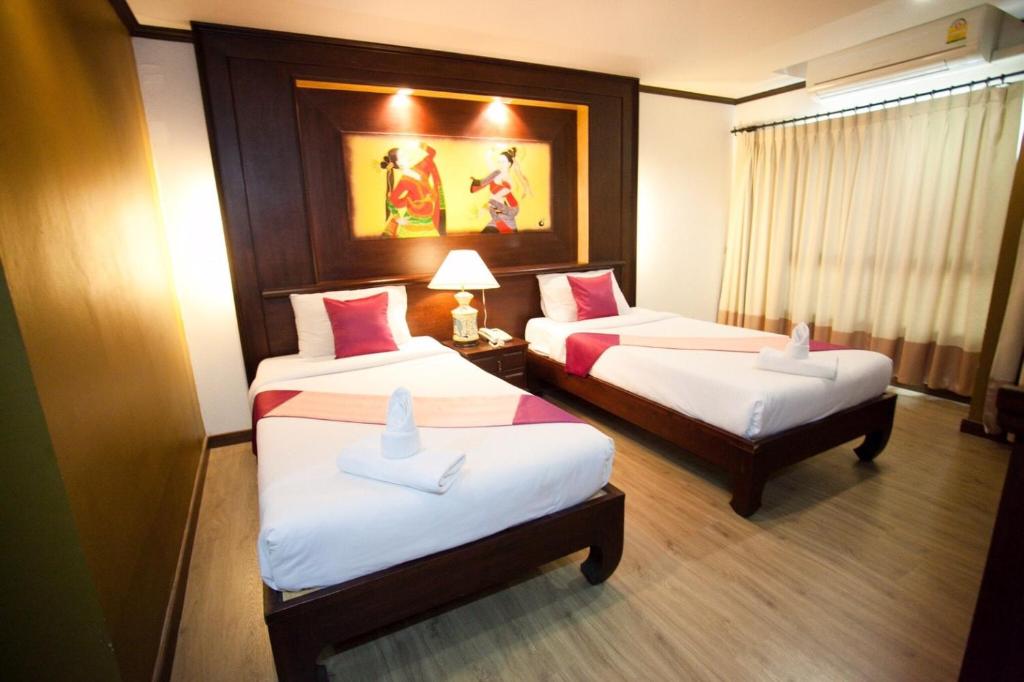 Postel nebo postele na pokoji v ubytování Chour Palace Hotel