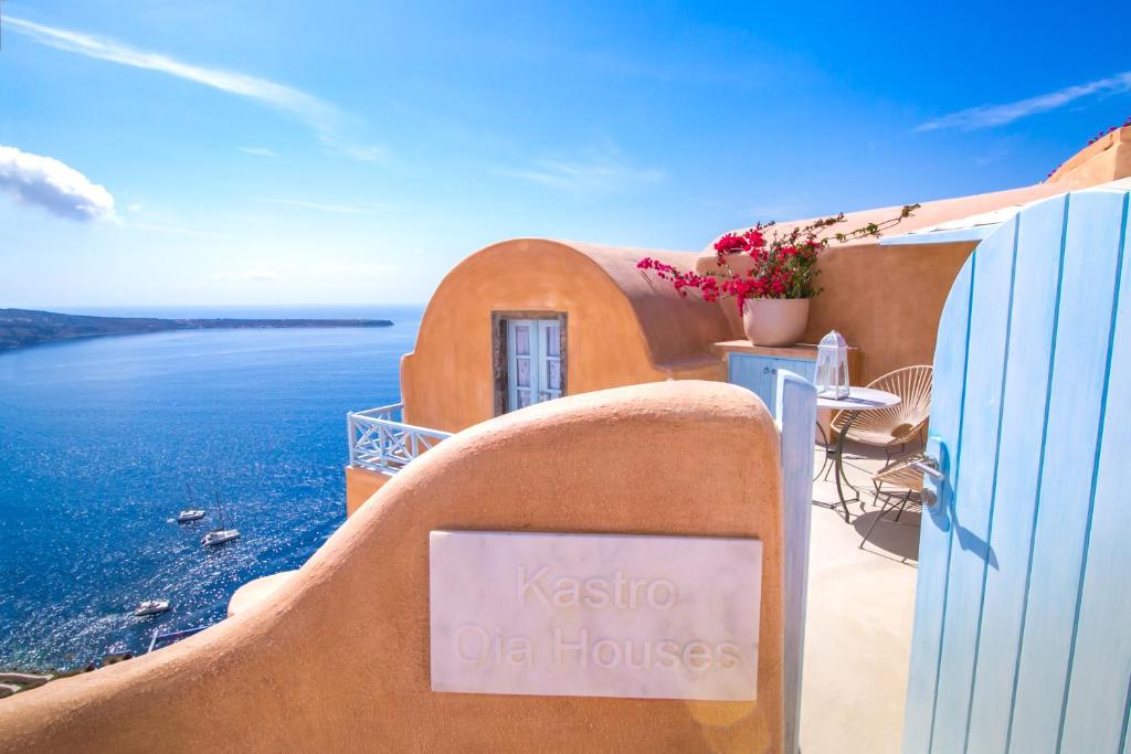 a view of a beach with a view of the ocean at Kastro Oia Houses in Oia