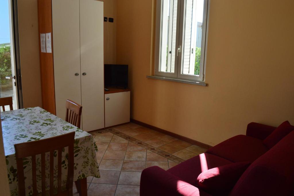 A television and/or entertainment centre at Residenza Villa Margherita