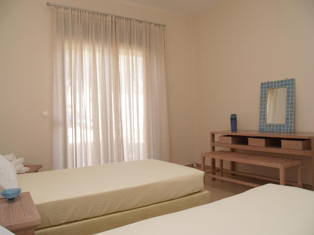 Postel nebo postele na pokoji v ubytování Villa Rotunda A