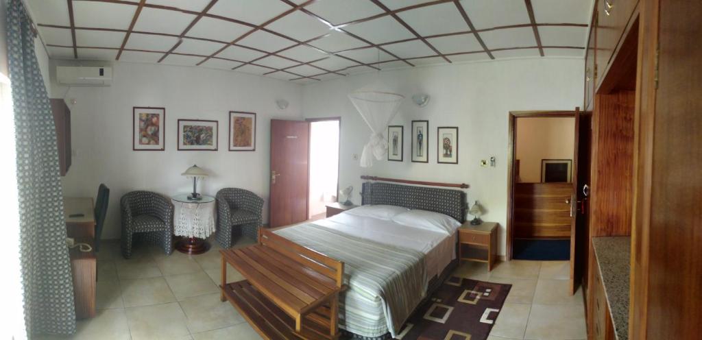 Postel nebo postele na pokoji v ubytování Manuela Residence