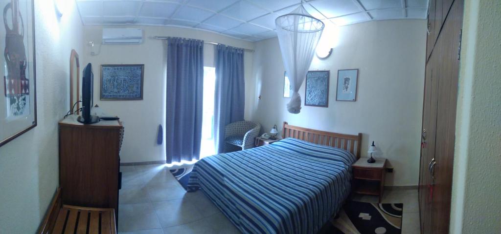 Postel nebo postele na pokoji v ubytování Manuela Residence