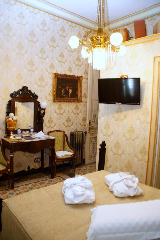 Posteľ alebo postele v izbe v ubytovaní Sitges Royal Rooms