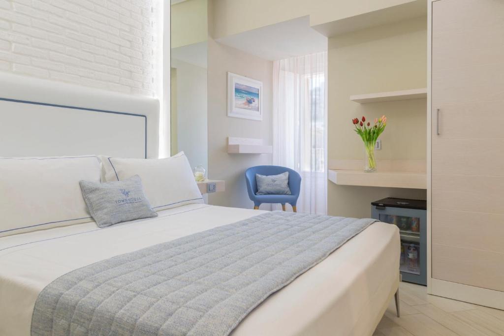 Łóżko lub łóżka w pokoju w obiekcie Townhouse Tropea