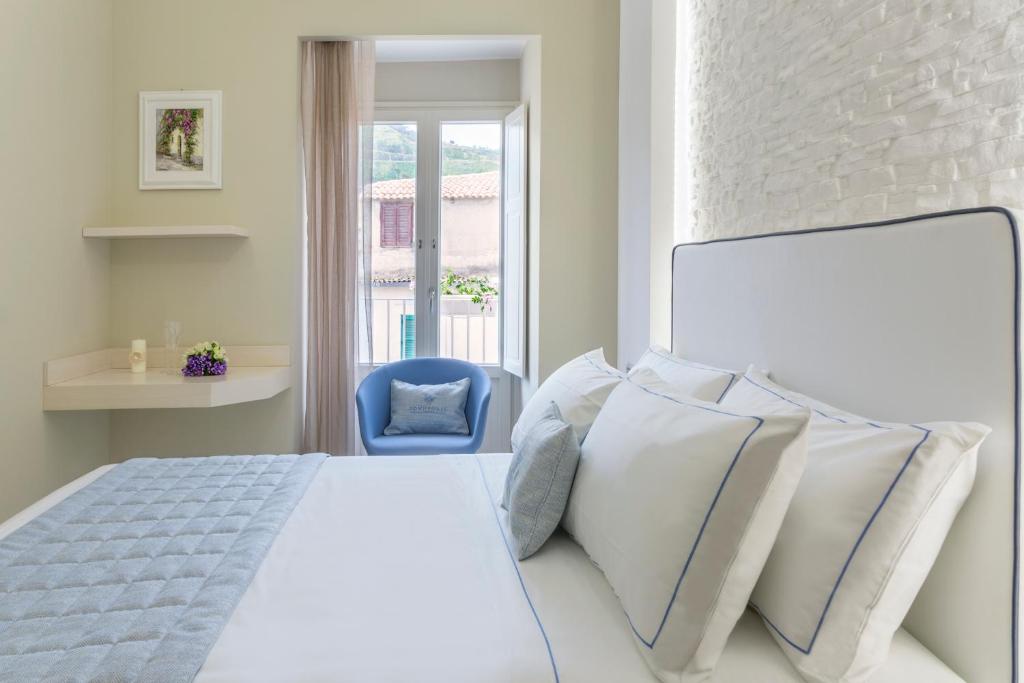 Łóżko lub łóżka w pokoju w obiekcie Townhouse Tropea