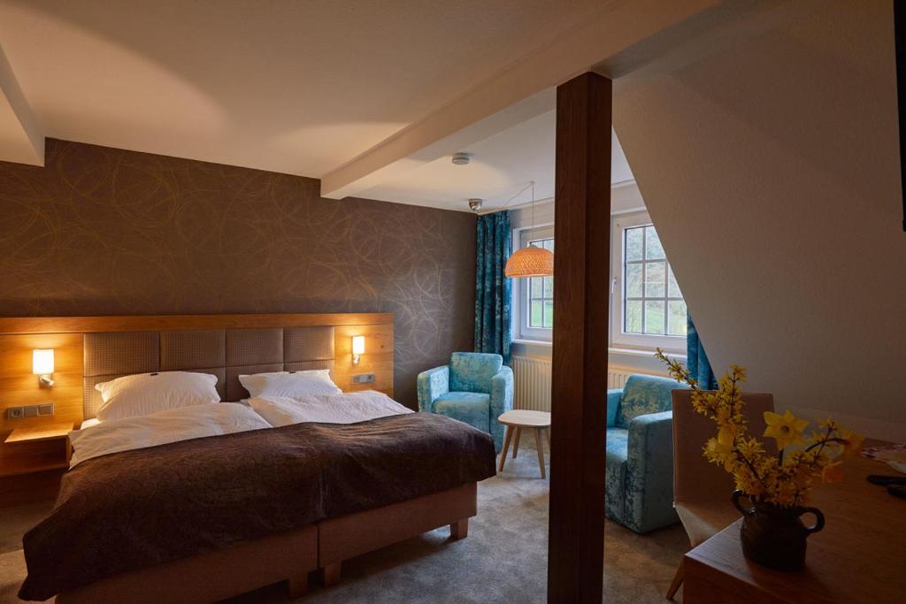 Postel nebo postele na pokoji v ubytování Hotel Haus Recke