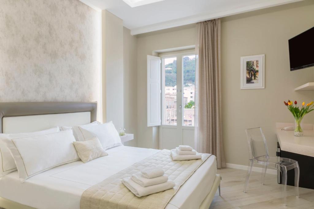 Łóżko lub łóżka w pokoju w obiekcie Townhouse Tropea