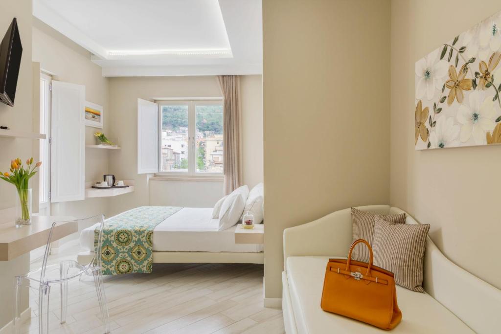 Łóżko lub łóżka w pokoju w obiekcie Townhouse Tropea