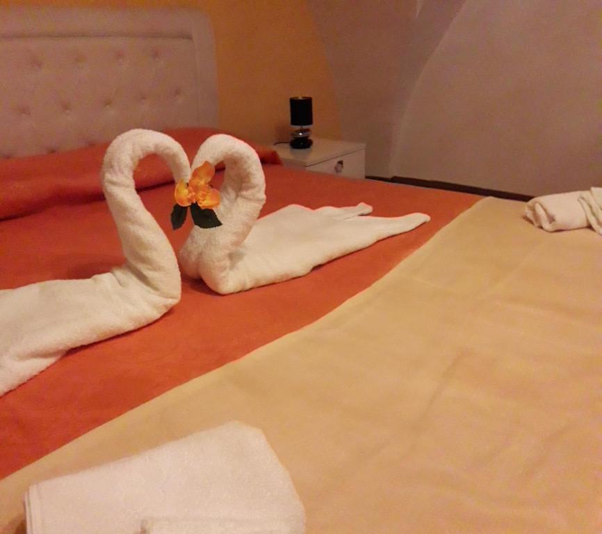 Postel nebo postele na pokoji v ubytování Aia Lucia B&B