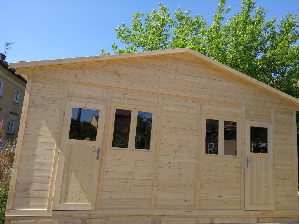 a large wooden shed with windows on top at Prague Retro Challenge and Garden in Prague