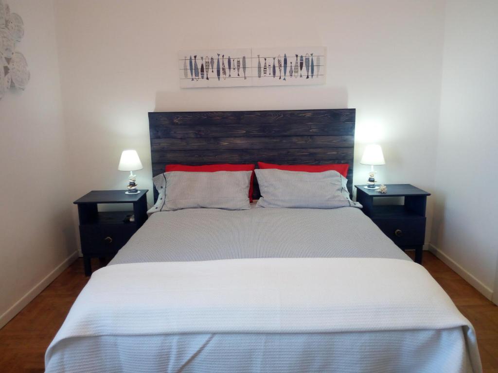 Postel nebo postele na pokoji v ubytování Ambrosio home