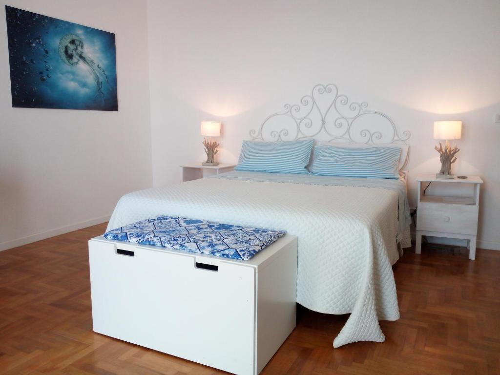 Postel nebo postele na pokoji v ubytování Ambrosio home