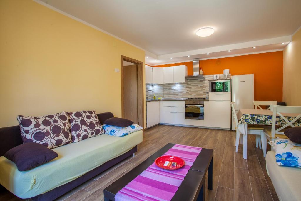 a living room with a couch and a table at Apartment Dunja in Cres