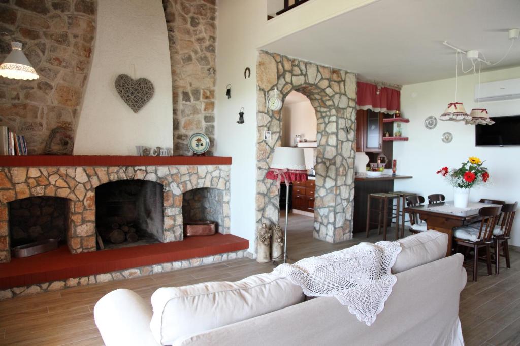 a living room with a couch and a fireplace at La Dimora Del Cuore in Monopoli