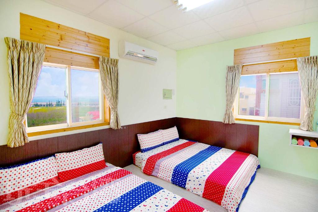 Postel nebo postele na pokoji v ubytování Xiang Ting Homestay