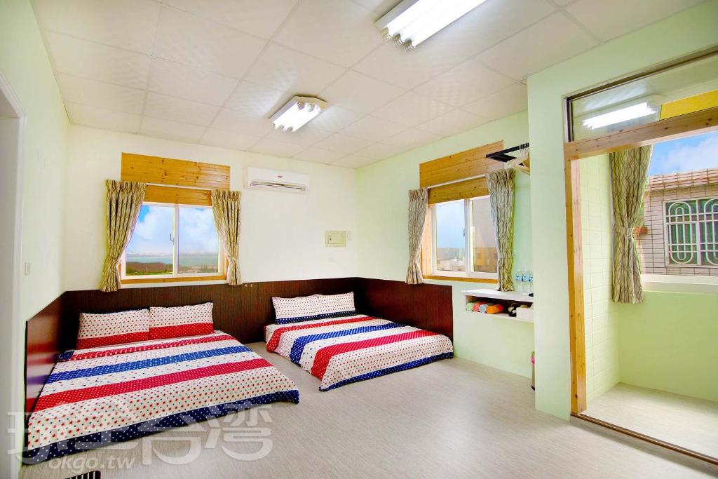 Postel nebo postele na pokoji v ubytování Xiang Ting Homestay