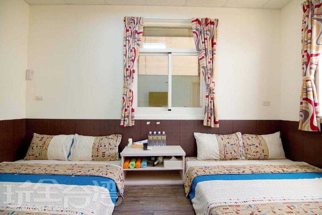 Postel nebo postele na pokoji v ubytování Xiang Ting Homestay