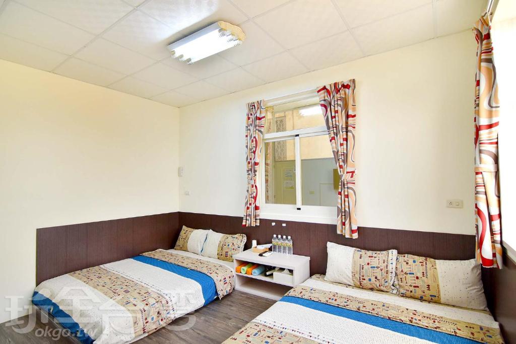 Postel nebo postele na pokoji v ubytování Xiang Ting Homestay