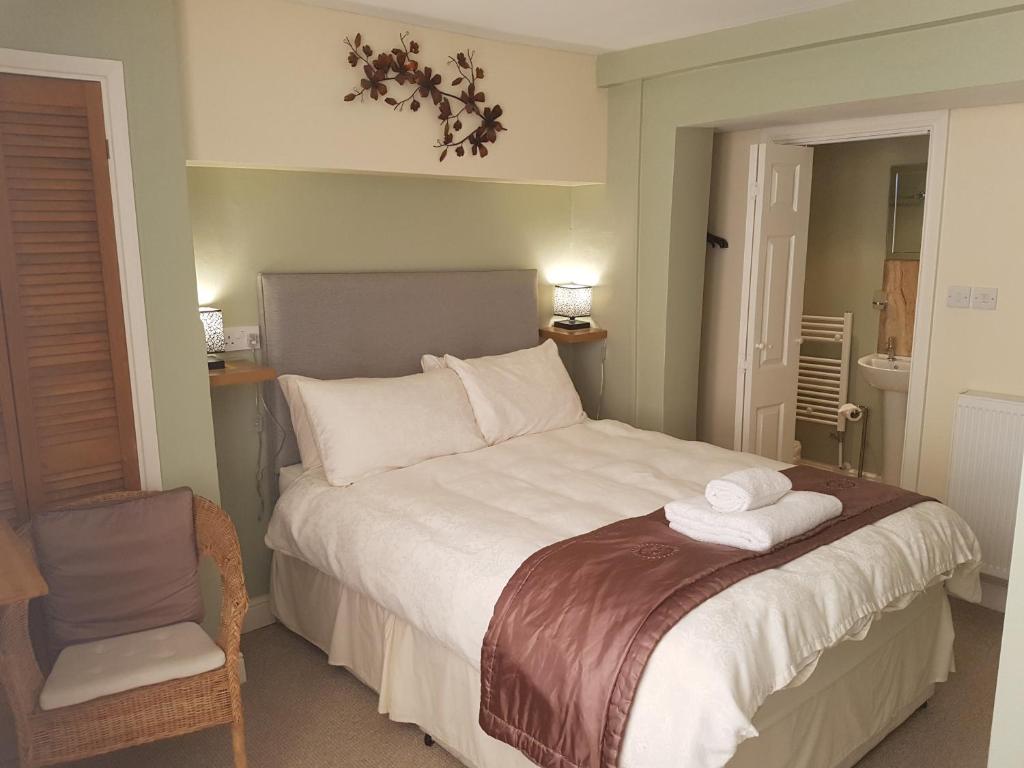 Katil atau katil-katil dalam bilik di Riverside Guest House