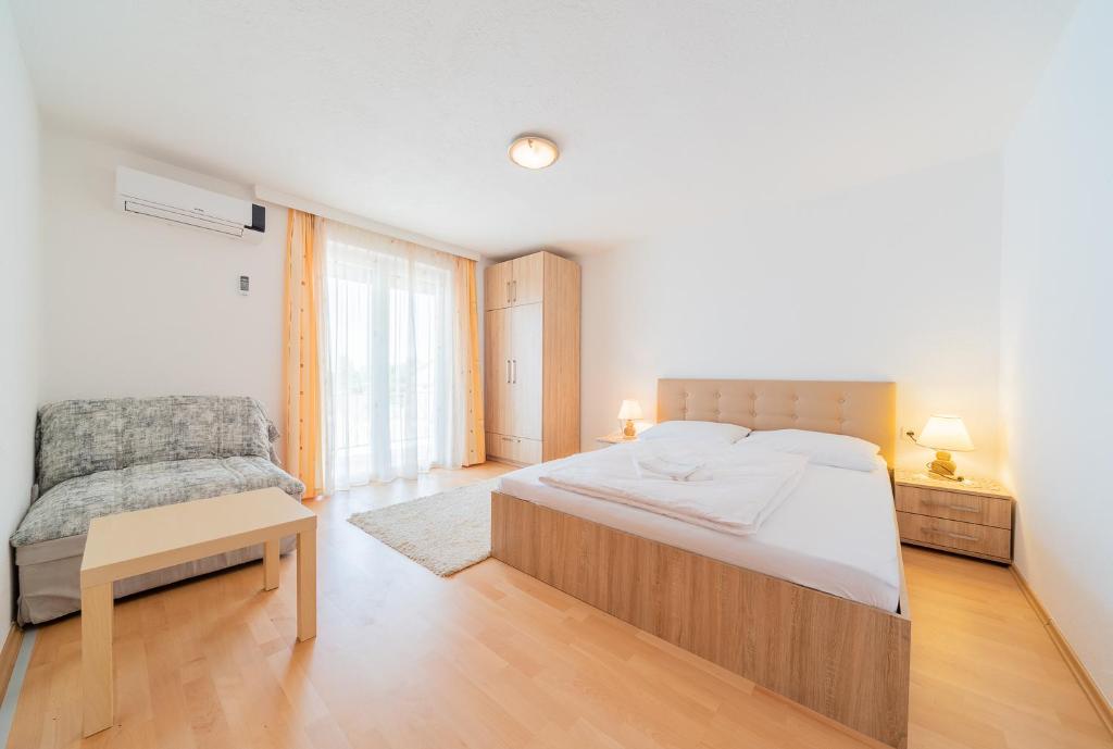 Posteľ alebo postele v izbe v ubytovaní Apartmenthaus Hana