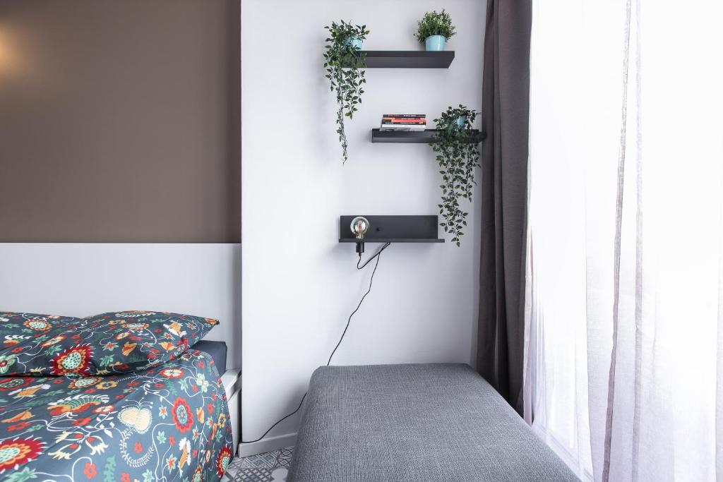 Postel nebo postele na pokoji v ubytování Studio Air d'été