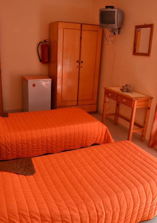 A bed or beds in a room at Noufaro studios