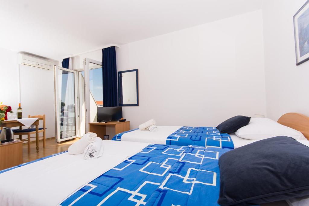 Posteľ alebo postele v izbe v ubytovaní Marko Apartments