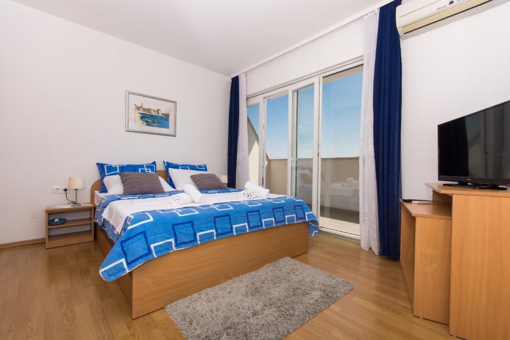 Posteľ alebo postele v izbe v ubytovaní Marko Apartments