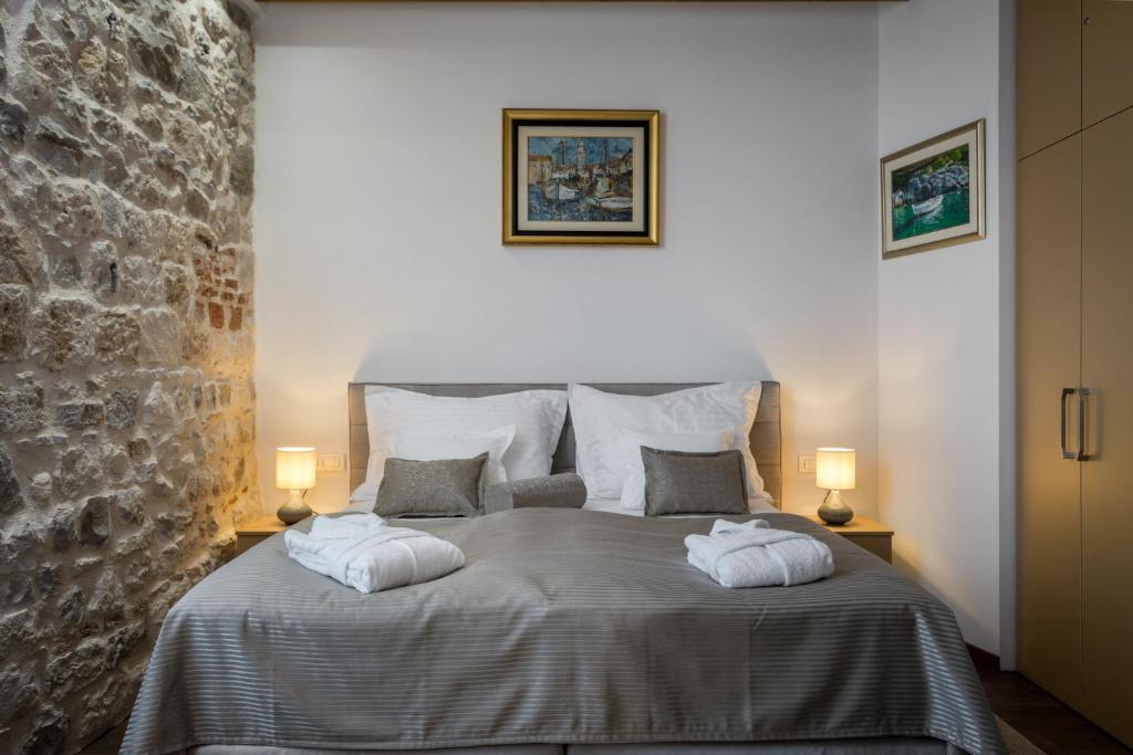 Posteľ alebo postele v izbe v ubytovaní ID Regal Residence