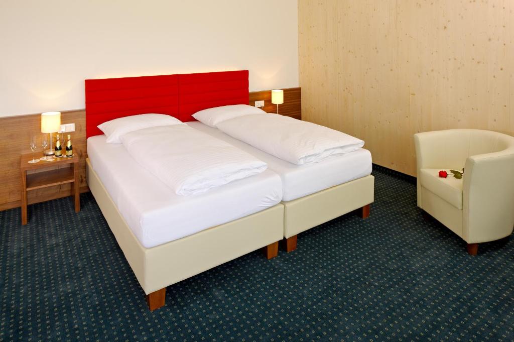 Postel nebo postele na pokoji v ubytování MT Hotel