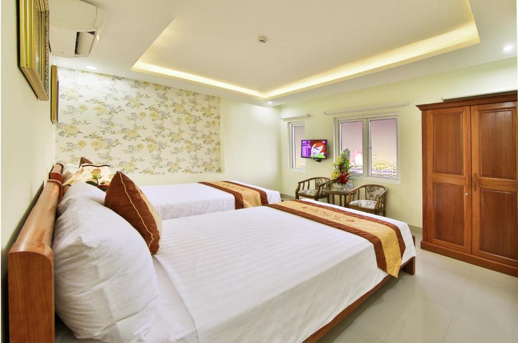 Postel nebo postele na pokoji v ubytování Sen Vang Hotel