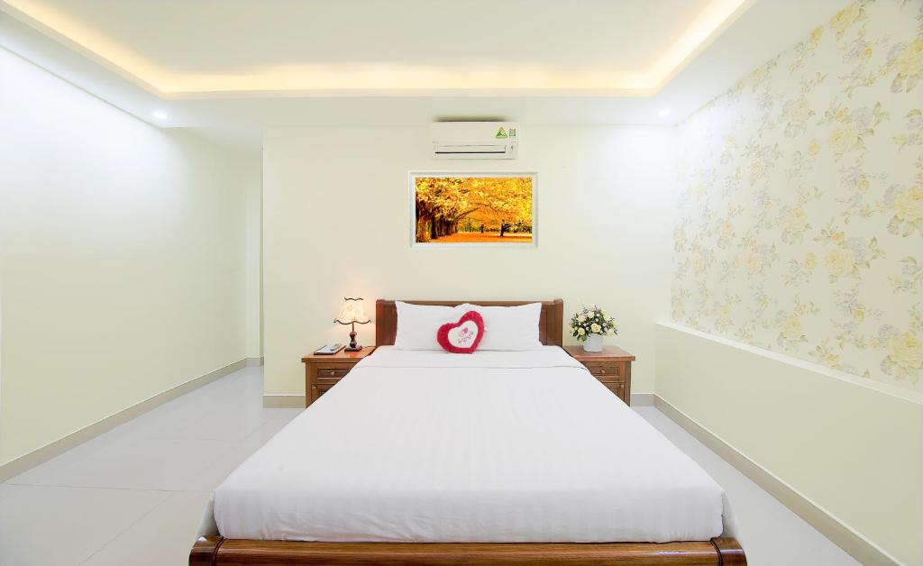 Postel nebo postele na pokoji v ubytování Sen Vang Hotel