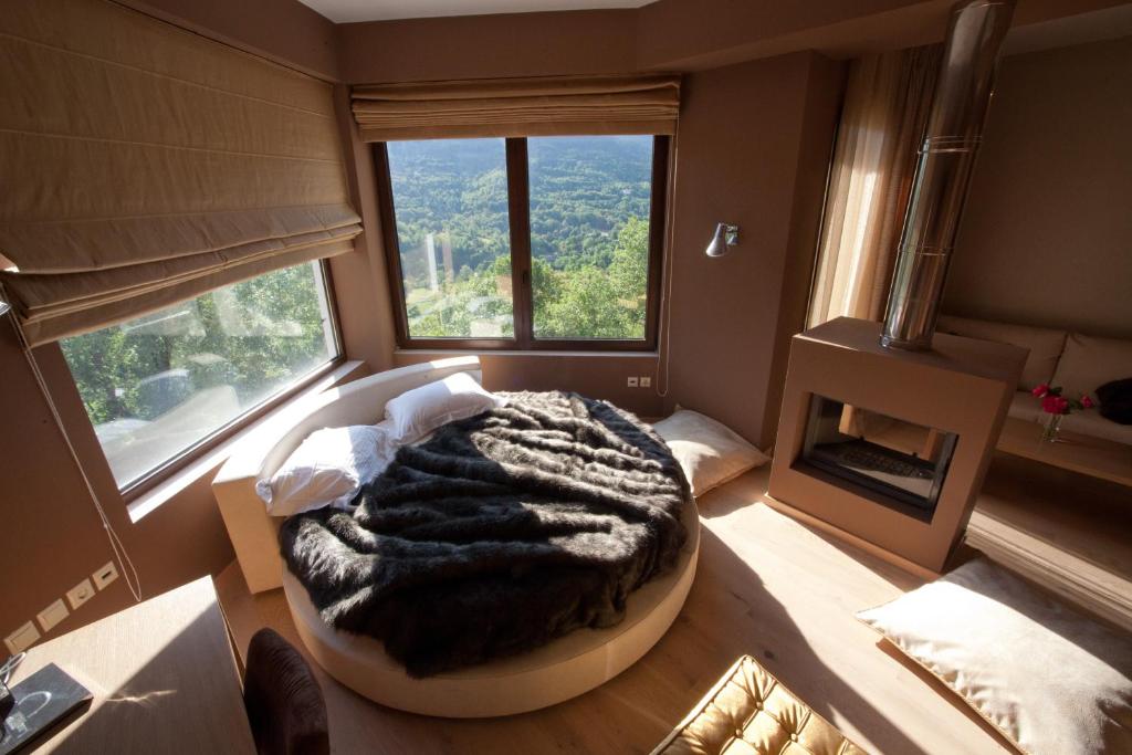 Postel nebo postele na pokoji v ubytování Forest Suites Boutique Hotel
