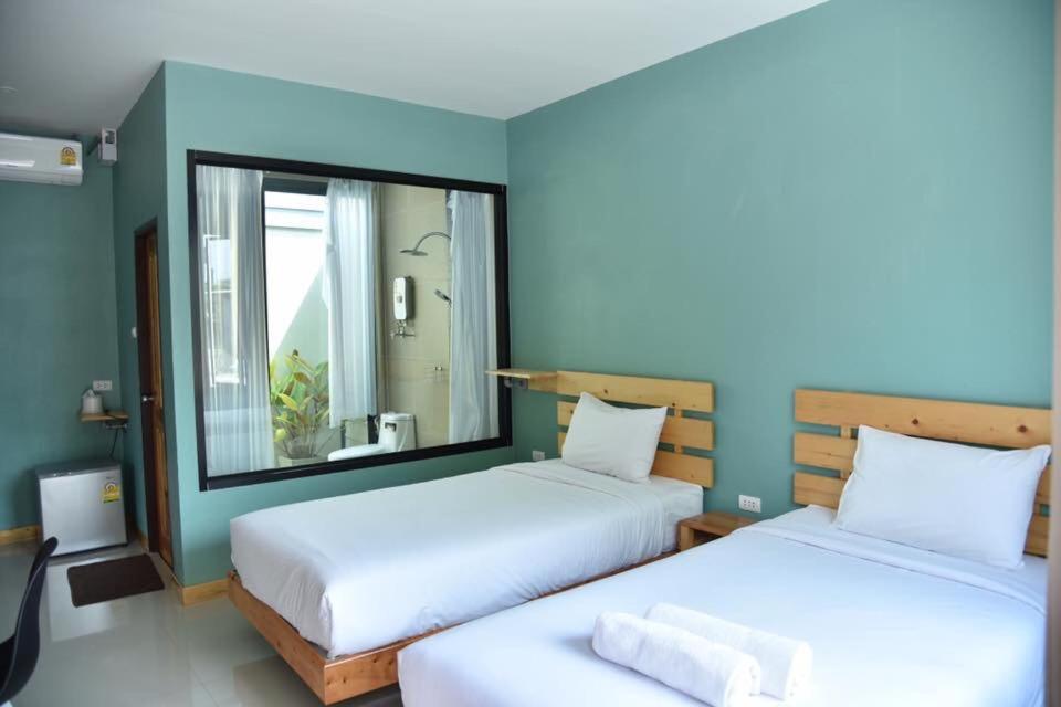 Postel nebo postele na pokoji v ubytování Rest Time Hotel