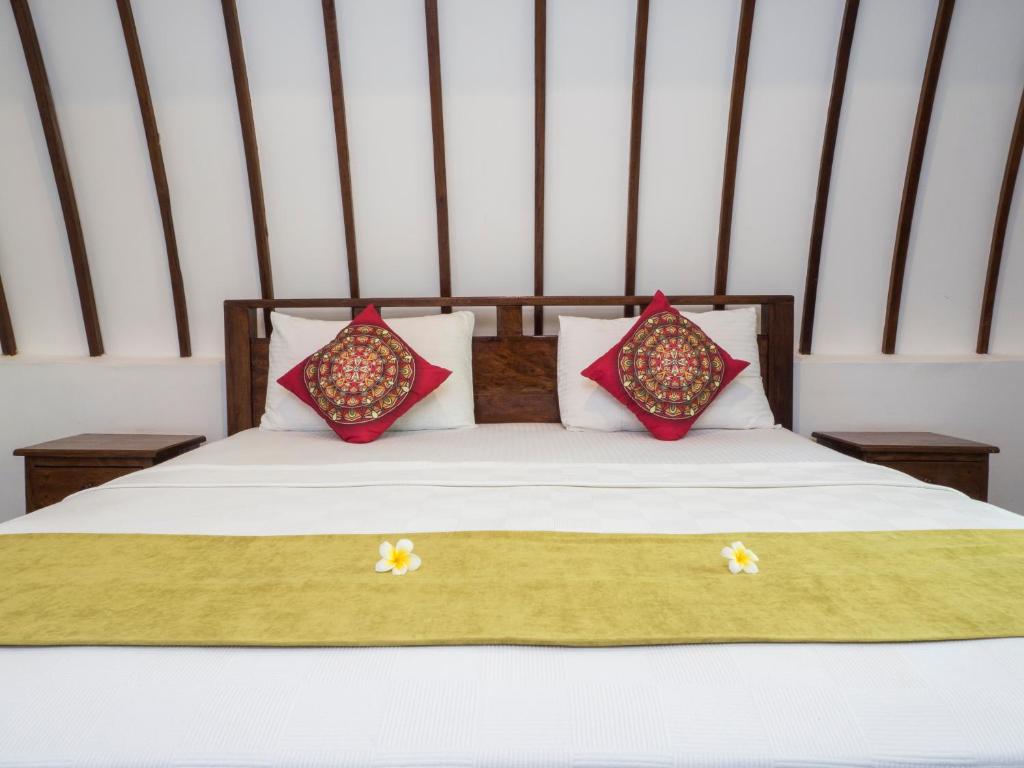 Postel nebo postele na pokoji v ubytování Gili Turtle Beach Resort