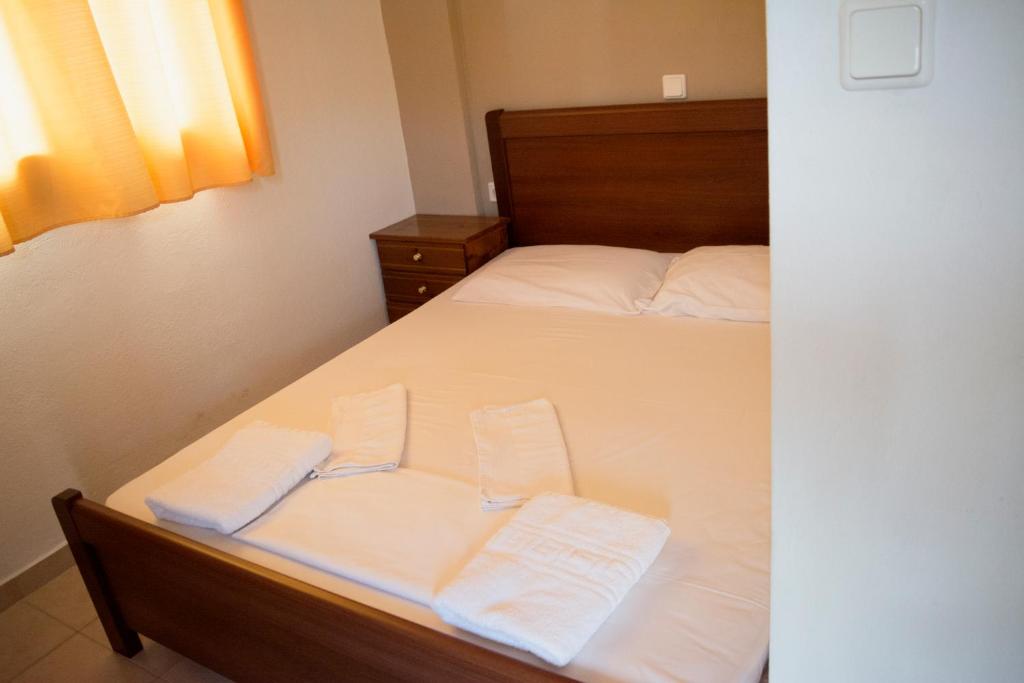 Postel nebo postele na pokoji v ubytování Hotel Paralia