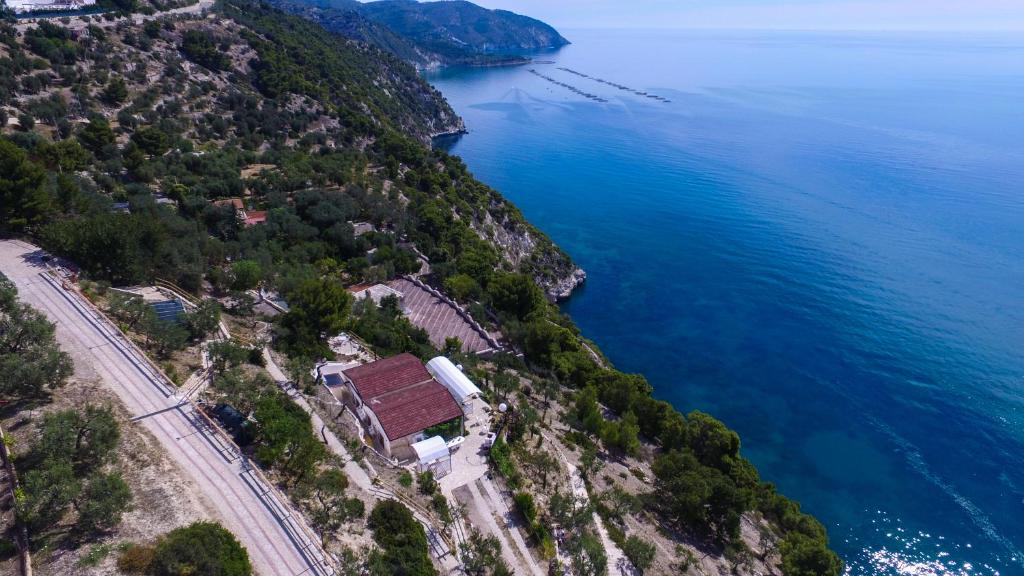 an aerial view of the shore of the ocean at Punta Palivi in Mattinata