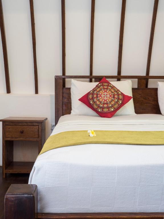 Postel nebo postele na pokoji v ubytování Gili Turtle Beach Resort