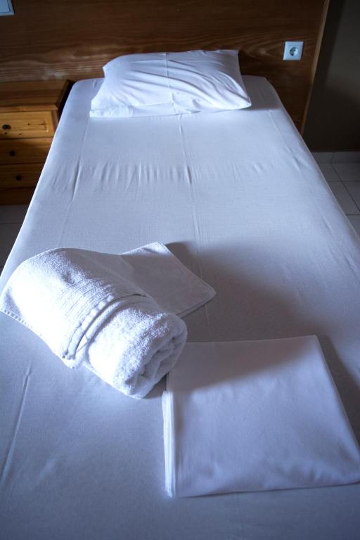 Postel nebo postele na pokoji v ubytování Hotel Paralia