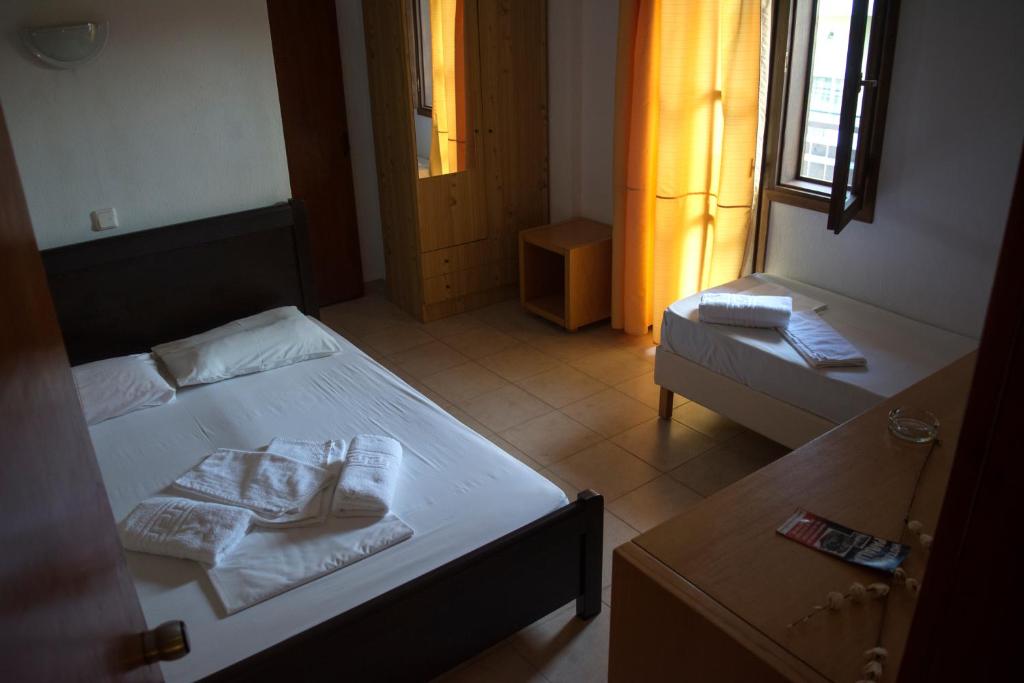 Postel nebo postele na pokoji v ubytování Hotel Paralia
