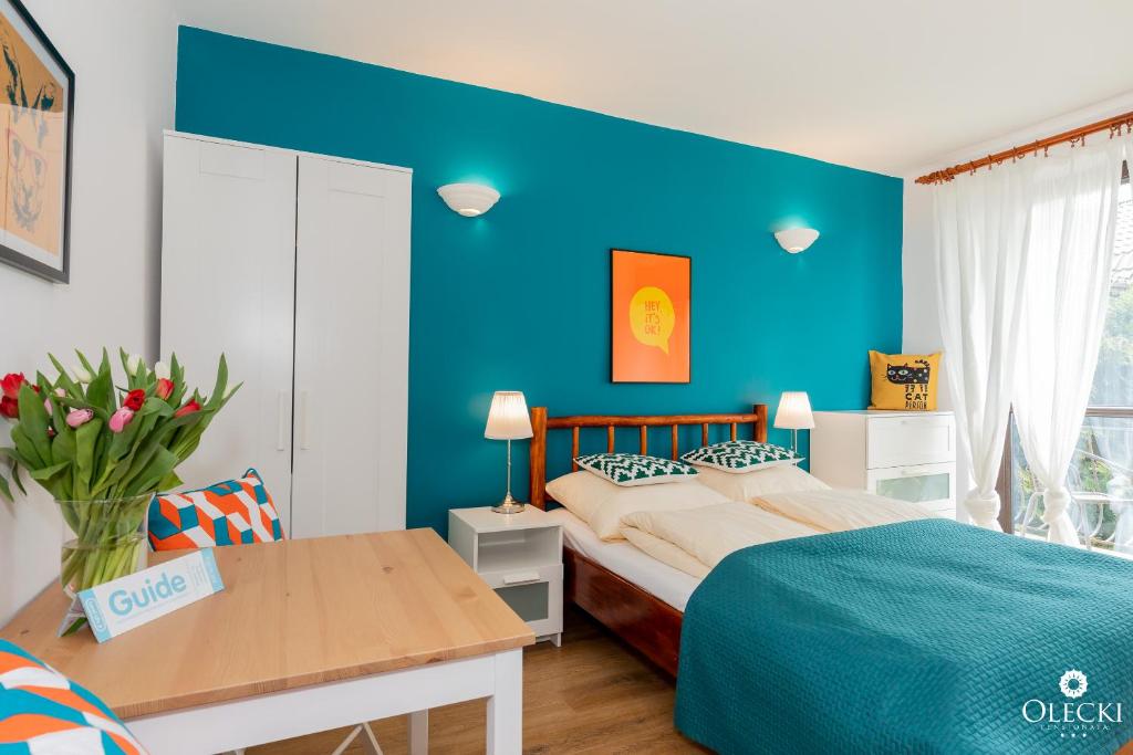 Posteľ alebo postele v izbe v ubytovaní OLECKI Holiday House