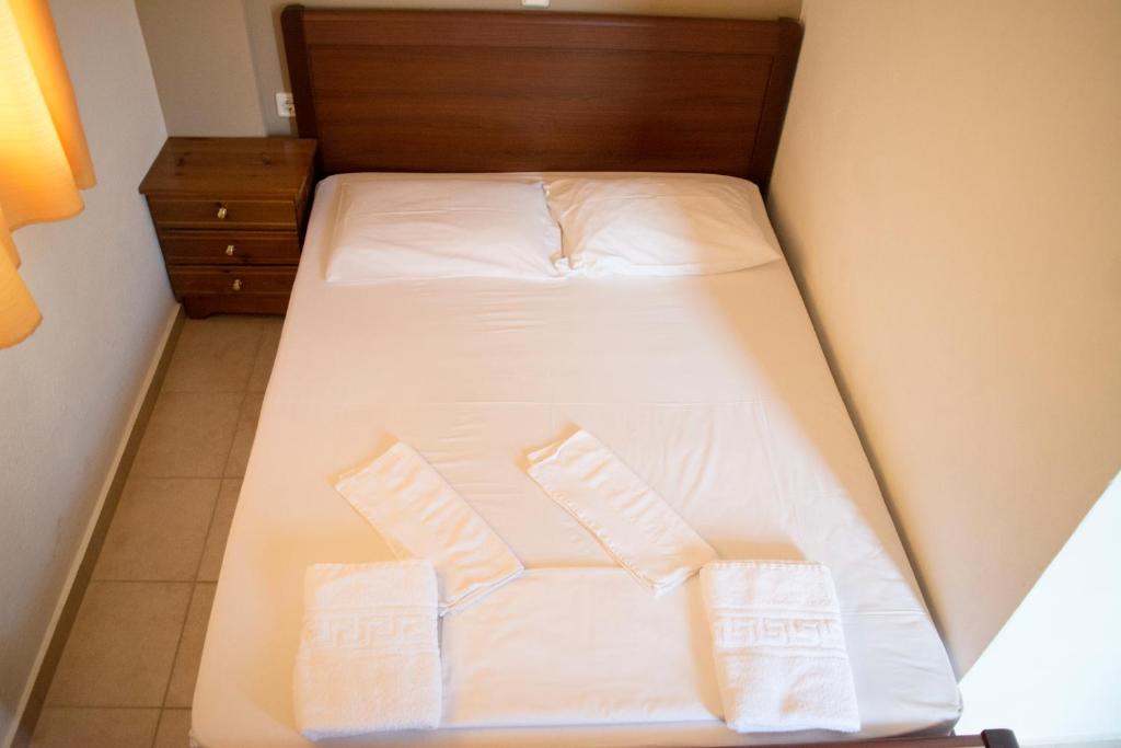 Postel nebo postele na pokoji v ubytování Hotel Paralia