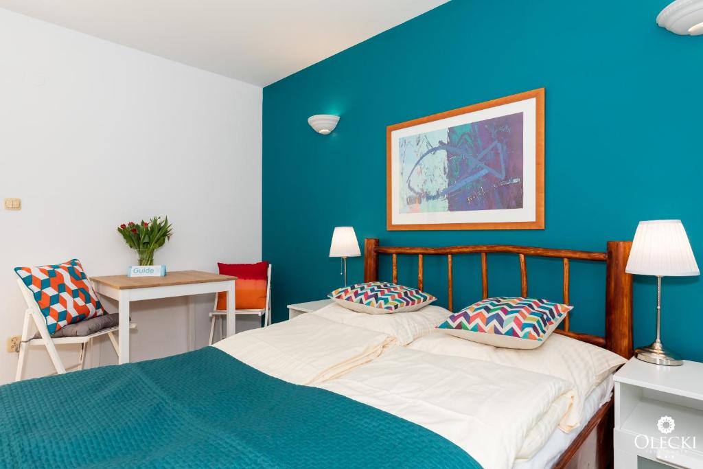 Posteľ alebo postele v izbe v ubytovaní OLECKI Holiday House